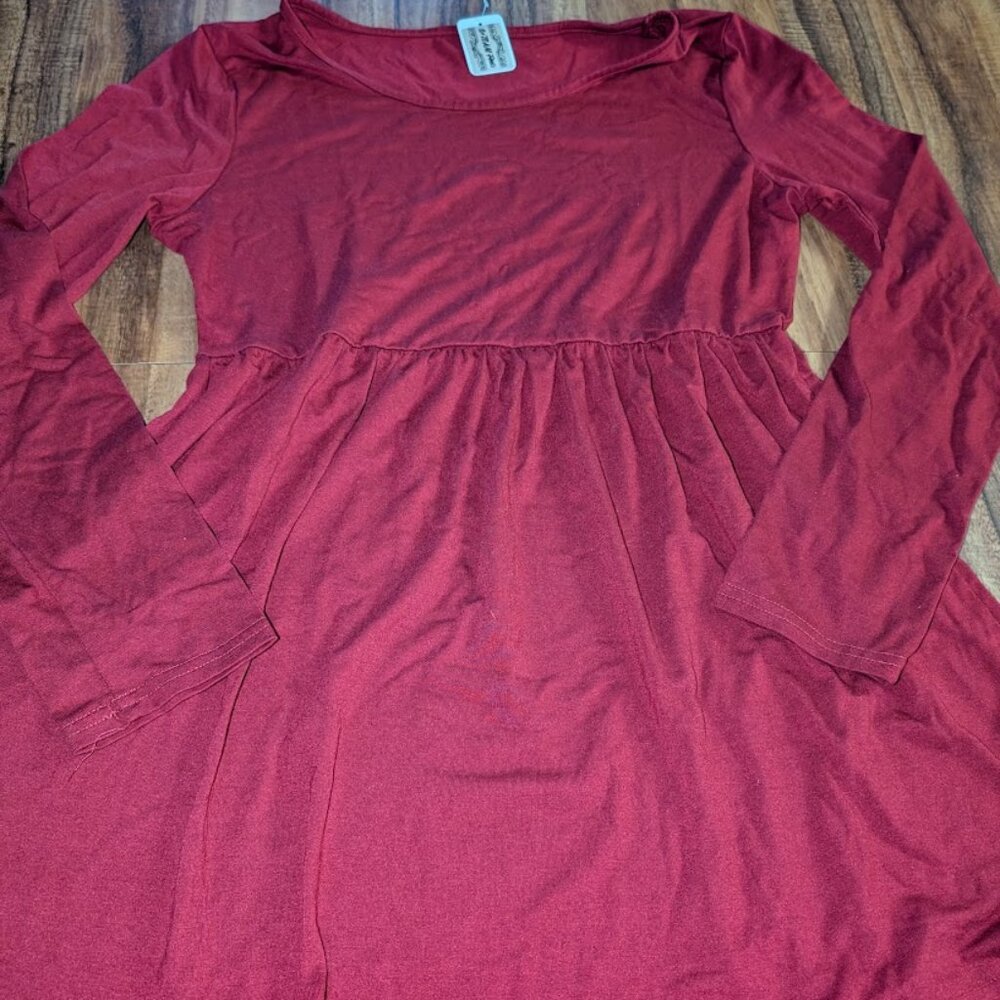 Long sleeve red women's top with flared bottom